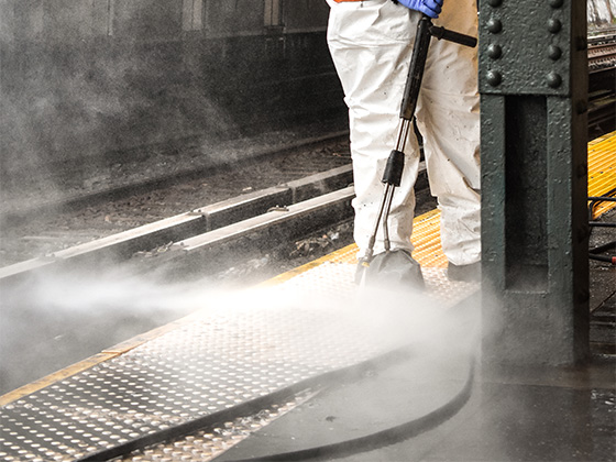 Steam cleaning the subway passenger area